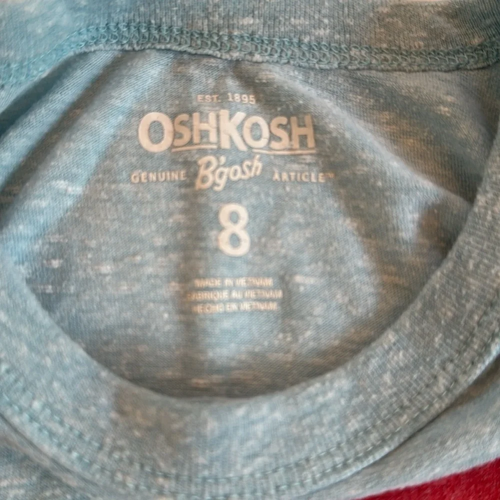 Size 8, Oshkosh T-shirt. Number 18.